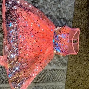 Pink sparkle dress with bow on the back and zipper to include.